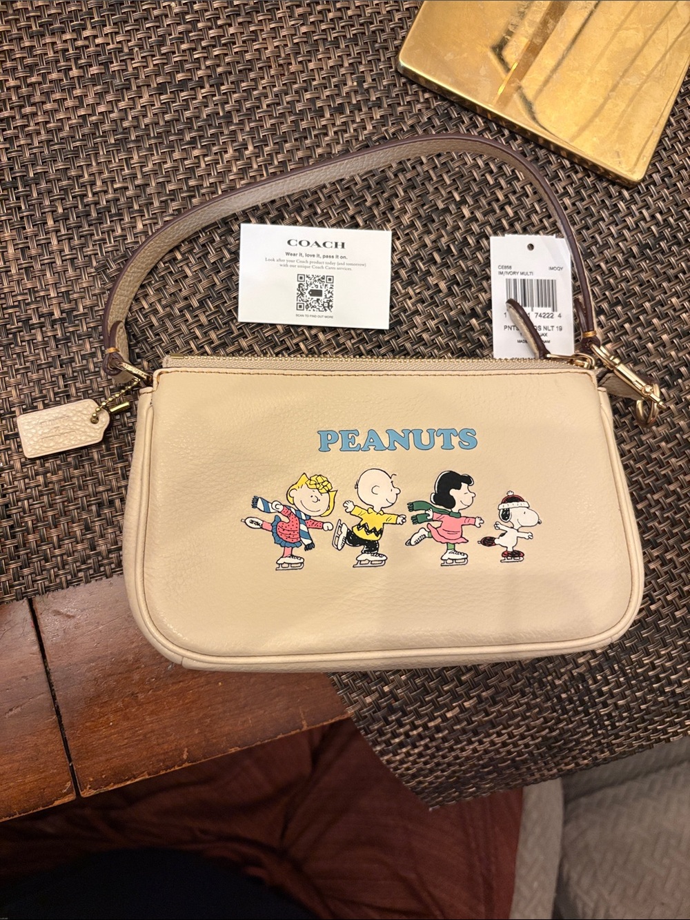 Coach new w tags Beige Peanuts Leather Mini Wristlet w Cartoon Print Retail 228
